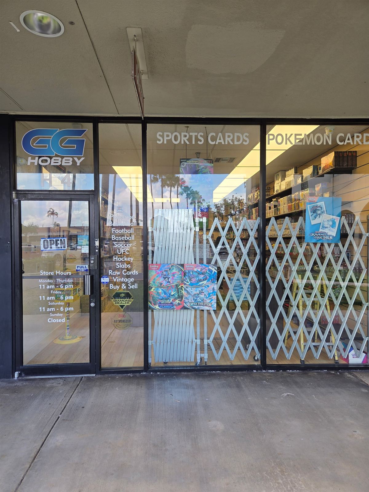 The GG Hobby storefront in Aventura — sports cards and Pokémon cards signage with the GG logo